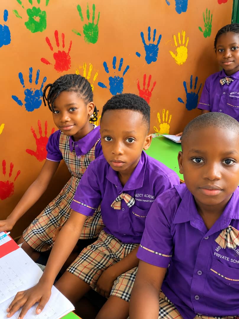 Mercy Academy pupils sharing a moment together in class